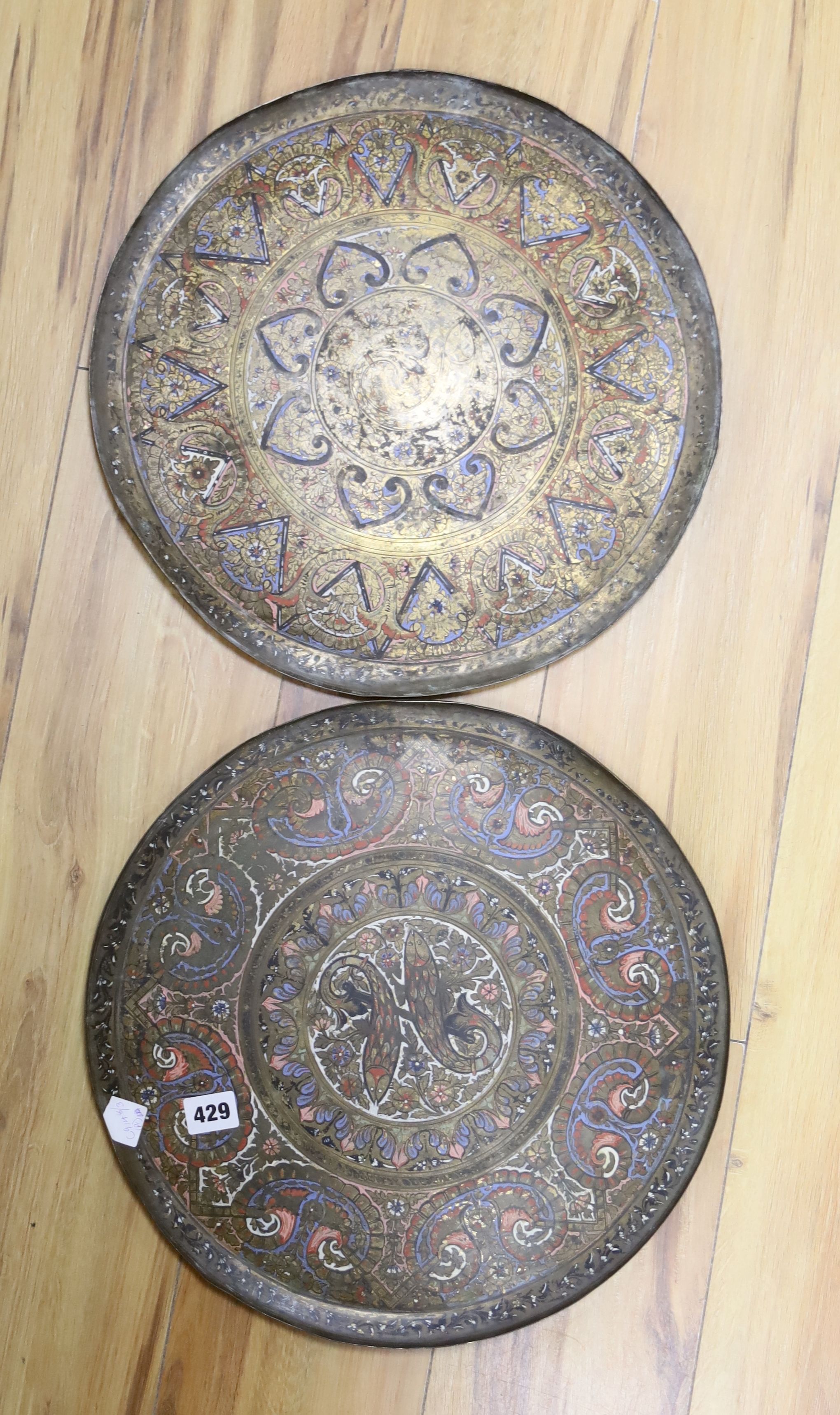 A pair of Islamic enamelled brass trays, diameter 38cm